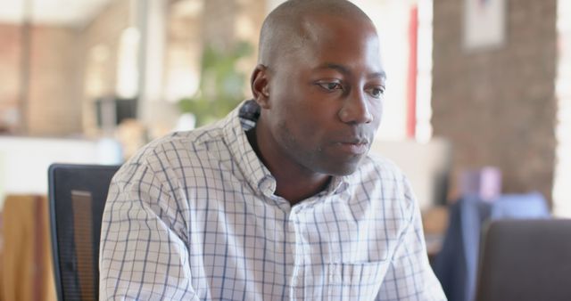 Focused African American Man Working on Laptop in Casual Office - Download Free Stock Images Pikwizard.com