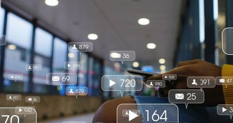 Woman scrolling smartphone at transit station with floating social notifications