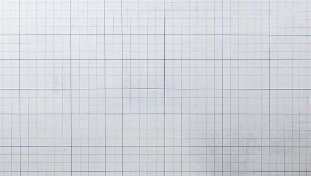 Blue grid paper showing square graph pattern with fifth-line guides and subtle smudges
