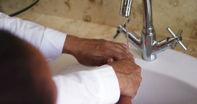 Close-up of Person Washing Hands in Sink Under Running Water - Download Free Stock Images Pikwizard.com