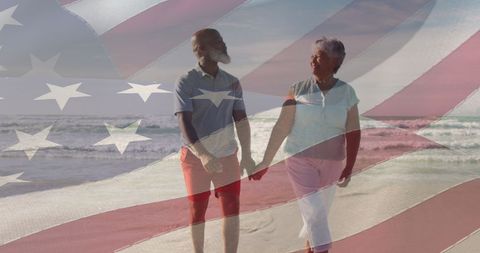Happy Senior Biracial Couple Walking on Beach with American Flag Overlay