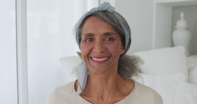 Joyful Mature Woman Smiling at Home in Bright Living Room - Download Free Stock Images Pikwizard.com