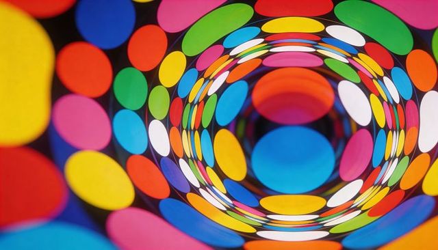 Multicolored Dot Vortex Tunnel Featuring Concentric Circles and Neon Rings