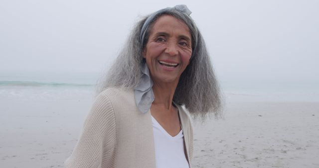 Smiling Senior Woman Enjoying Beach Outdoors - Download Free Stock Images Pikwizard.com