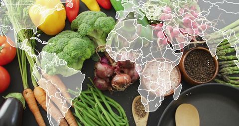World Map Overlay with Fresh Vegetables Symbolizing Global Veganism