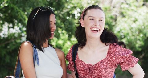Two Happy Female Friends Enjoying Outdoor Summer Day