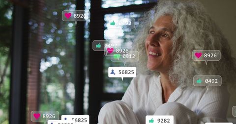 Joyful Mature Woman Interacting with Social Media at Home