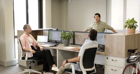 Diverse Team Collaborating at Modern Open-Plan Office