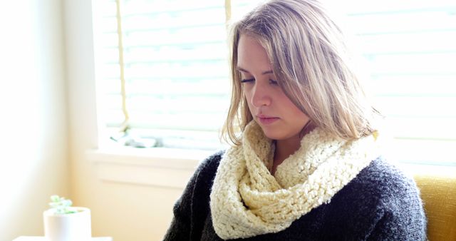 Woman Wearing Warm Scarf While Reading in Cozy Home - Download Free Stock Images Pikwizard.com