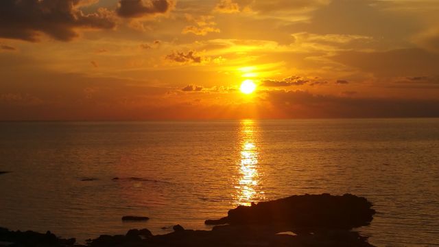 Golden Sunset Over Calm Sea - Download Free Stock Photos Pikwizard.com