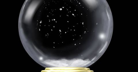 Luxurious Snow Globe Displaying Swirling Snow Particles on Golden Base