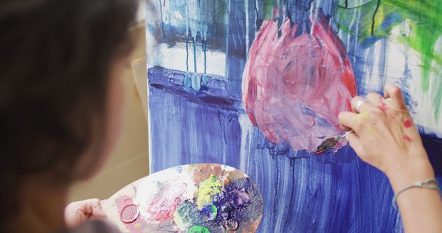 Image of hands of biracial female artist painting in studio - Download Free Stock Photos Pikwizard.com
