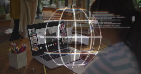 Child taking notes during virtual classroom with holographic globe overlay