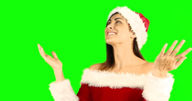 Excited Young Woman in Santa Claus Hat on Green Screen Background - Download Free Stock Images Pikwizard.com