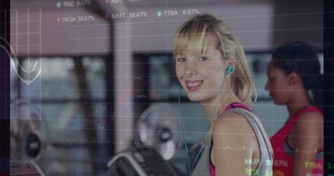 Woman on Treadmill in Gym Using Earphones for Workout