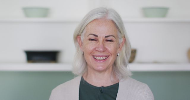 Happy Senior Woman Smiling in Home Interior - Download Free Stock Images Pikwizard.com