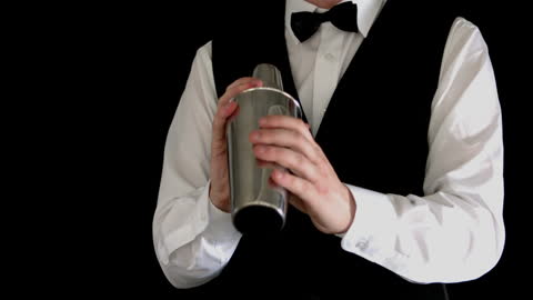 Bartender in Bowtie Preparing Signature Drink with Shaker