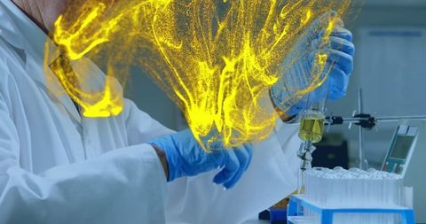 Senior Scientist Conducting Experiment with Yellow Liquid in Laboratory