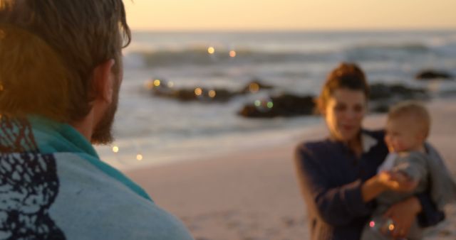 Family Enjoying Quality Time on Beach at Sunset - Download Free Stock Images Pikwizard.com