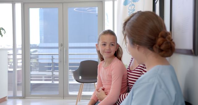 Mother and Daughter Waiting for Appointment in Modern Clinic - Download Free Stock Images Pikwizard.com