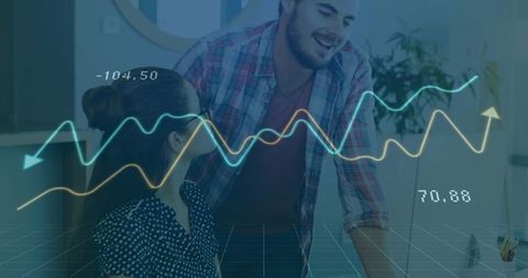 Colleagues analyzing digital charts in modern office