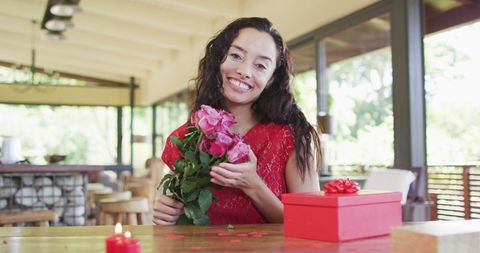 Happy Woman Holding Roses on Valentine's Day Video Call - Download Free Stock Images Pikwizard.com