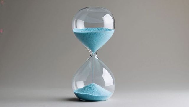 Elegantly designed hourglass with tranquil blue sand on display