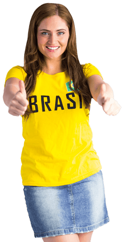 Cheerful woman giving thumbs up in transparent brazil t-shirt