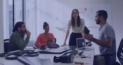 Engineers collaborating on drone and vr prototype design during hands-on product development meeting