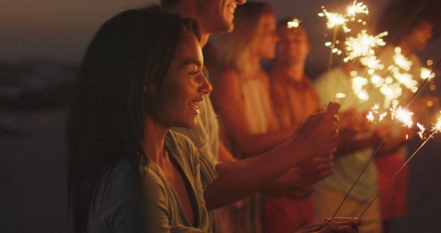 Friends Celebrating with Sparklers at Dusk - Download Free Stock Images Pikwizard.com