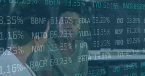 Business Colleagues Brainstorming Amidst Digital Stock Market Interface