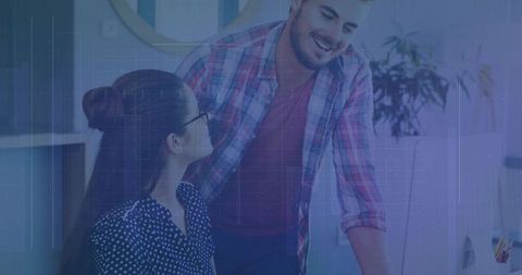 Colleagues Collaborating in Modern Office Setting with Computer Screen