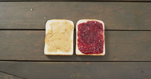 Close up view of peanut butter and jelly sandwich with copy space on wooden surface. food and nutrition concept