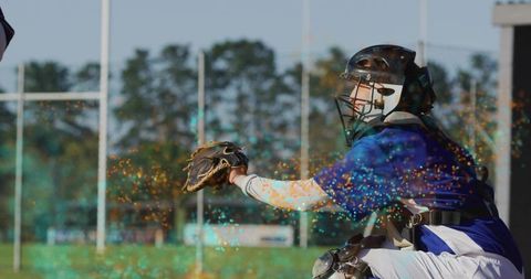 Female baseball catcher extending mitt with energy sparkles