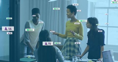 Businesswomen Analyzing Digital Overlays in Meeting Room