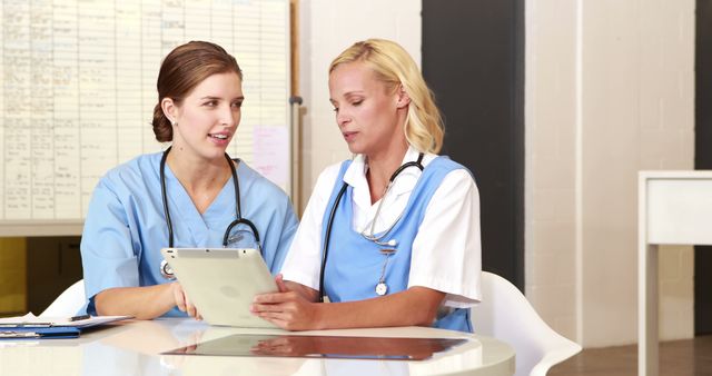 Medical Professionals Discussing Patient Record at Hospital - Download Free Stock Images Pikwizard.com