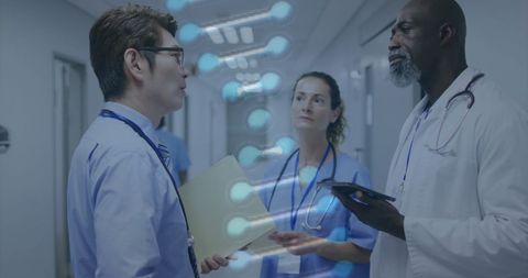 Diverse doctors discuss healthcare innovations in hospital