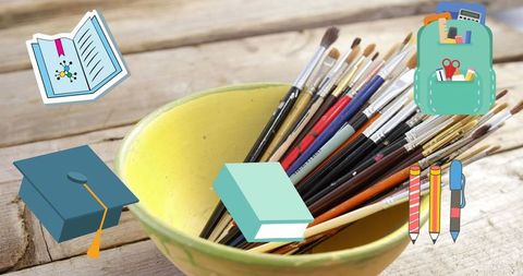 School and art supplies on wooden desk concept