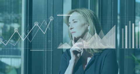 Businesswoman Analyzing Financial Trends in Modern Office - Download Free Stock Images Pikwizard.com
