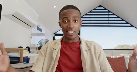 Confident man in home office conducting online video call
