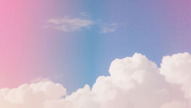 Dreamy Pastel Sky with Cumulus Clouds and Gradient Background