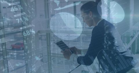 Businesswoman Analyzing Financial Data with Technological Interface - Download Free Stock Images Pikwizard.com