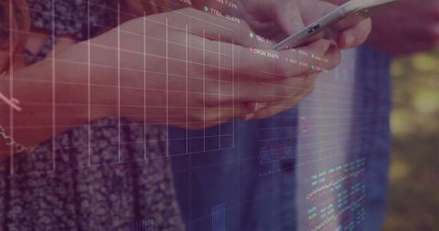 Hands holding smartphone with financial data overlays tapping for mobile trading outdoors