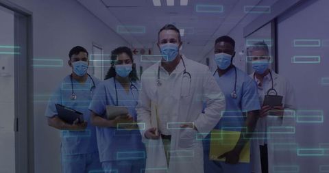 Healthcare team embracing technology in hospital corridor