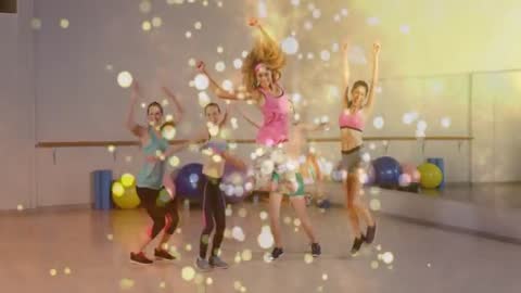 Energetic Group Fitness Routine with Dramatic Bokeh Lights