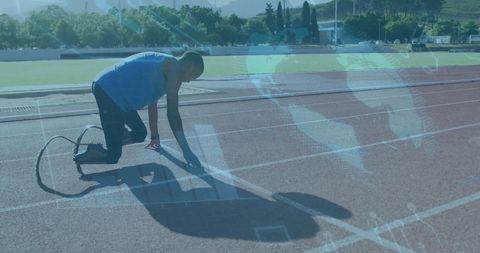 Athlete with Prosthetic Blade Ready to Sprint on Track