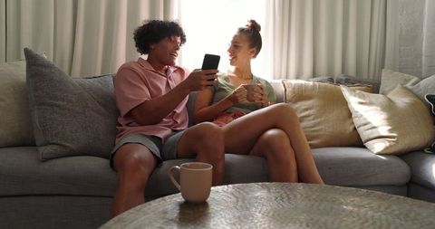 Happy Couple Relaxing on Cozy Sofa Sharing Moments