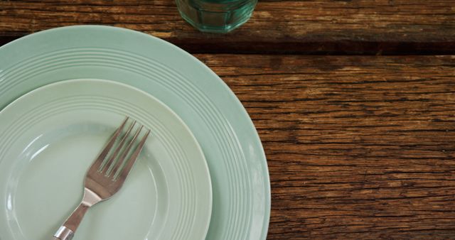 Pastel Green Dinnerware Set on Rustic Wooden Table - Download Free Stock Images Pikwizard.com