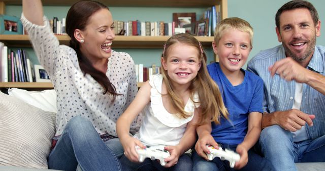Happy Family Playing Video Games Together at Home - Download Free Stock Images Pikwizard.com