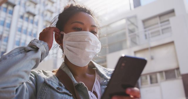 Woman Wearing Face Mask Using Smartphone Outdoors in Urban Area - Download Free Stock Images Pikwizard.com